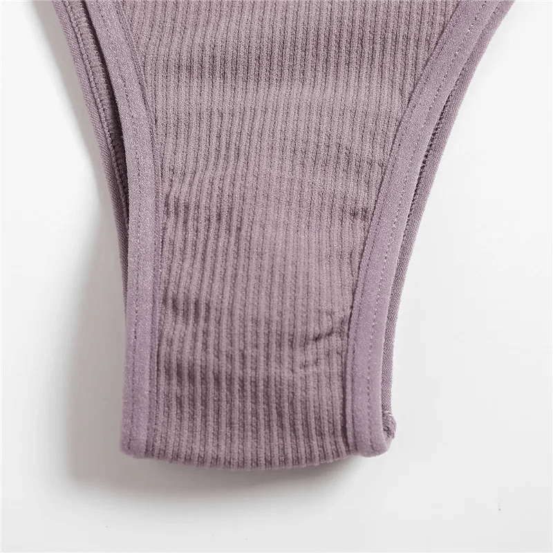 Sleek seamless G-string in lilac showcasing ribbed texture for a chic fit made from spandex and polyester. Ideal for any occasion.